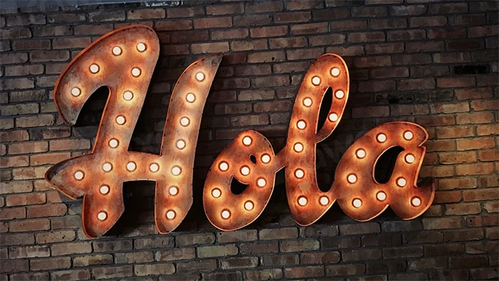 Illuminated sign saying HOLA