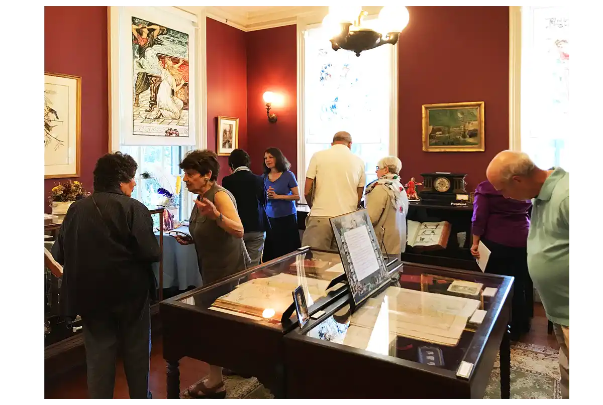 Photo of people viewing a new exhibition at the Athenaeum