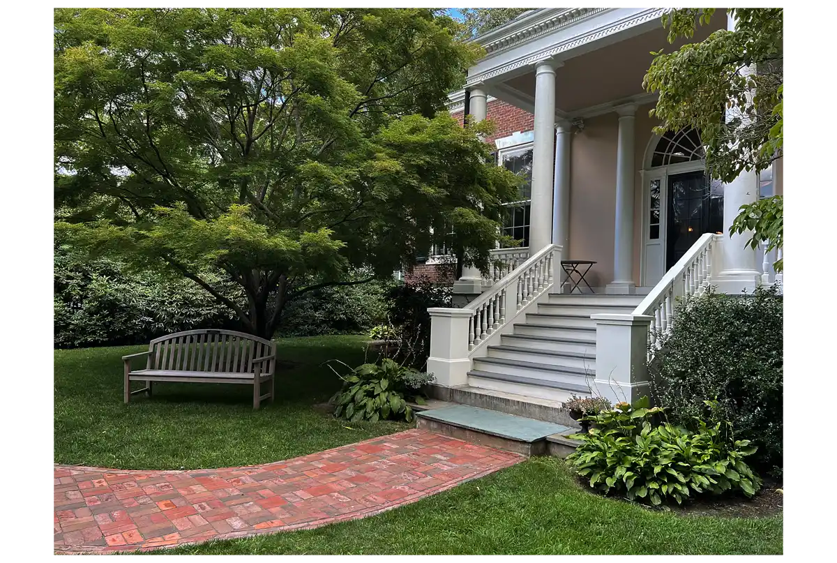 Garden Entrance brick walkway on grass leading up to steps