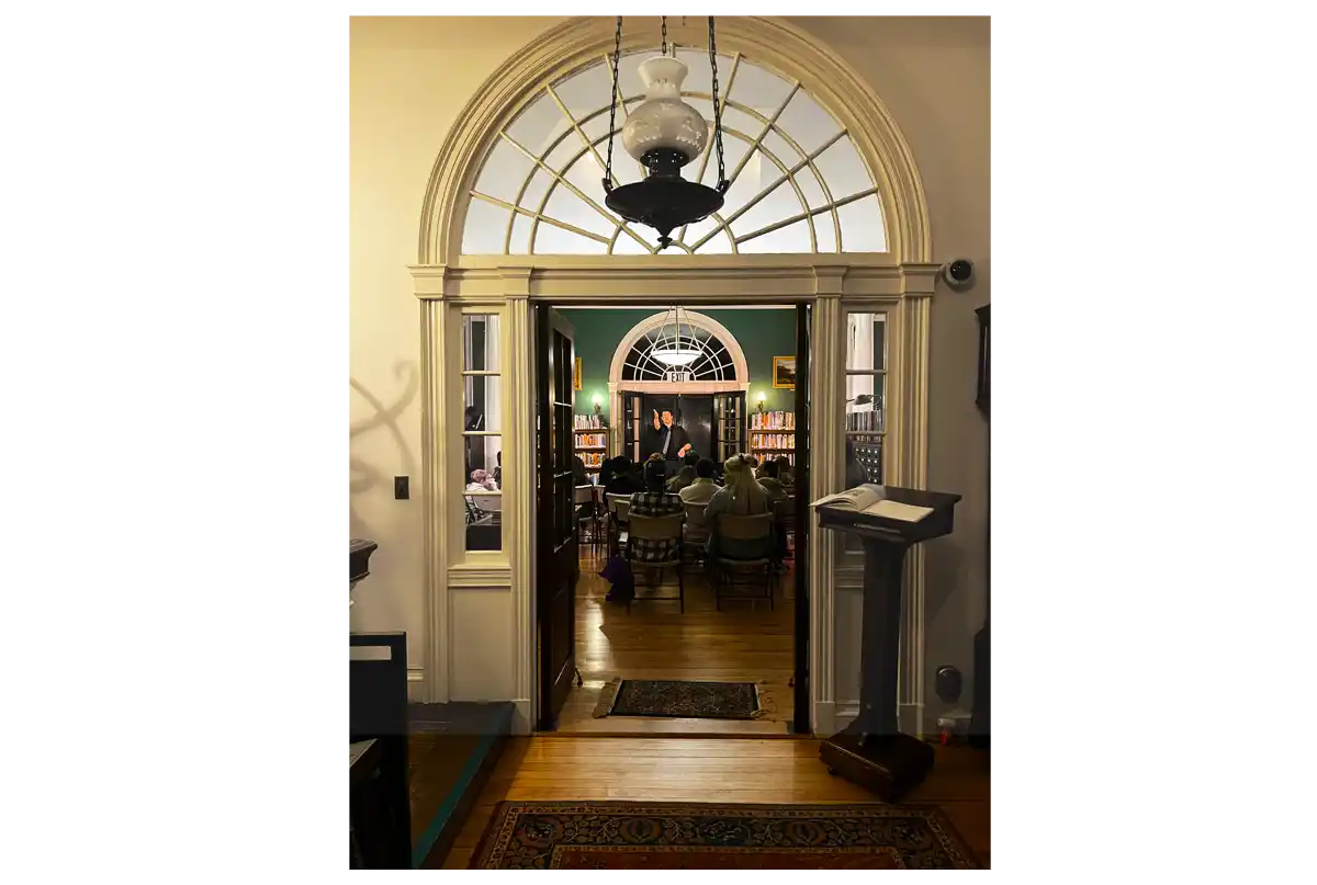 Photo looking at an Athenaeum event through the door from the foyer